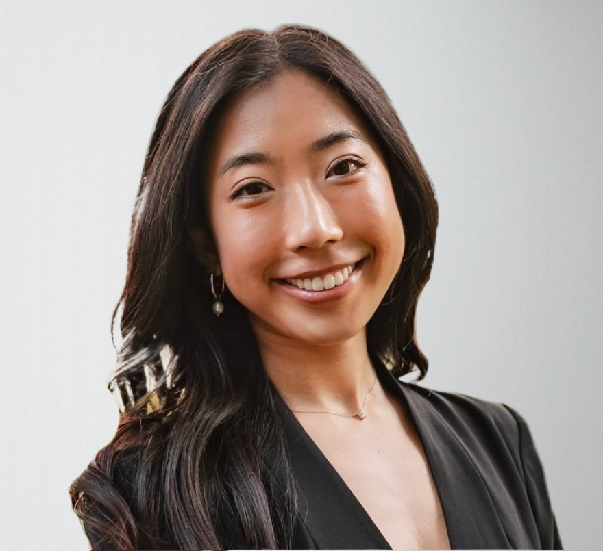 Young woman in a black blazer smiling, representing Serengeti Wellness's cultural competence in BIPOC mental health care.