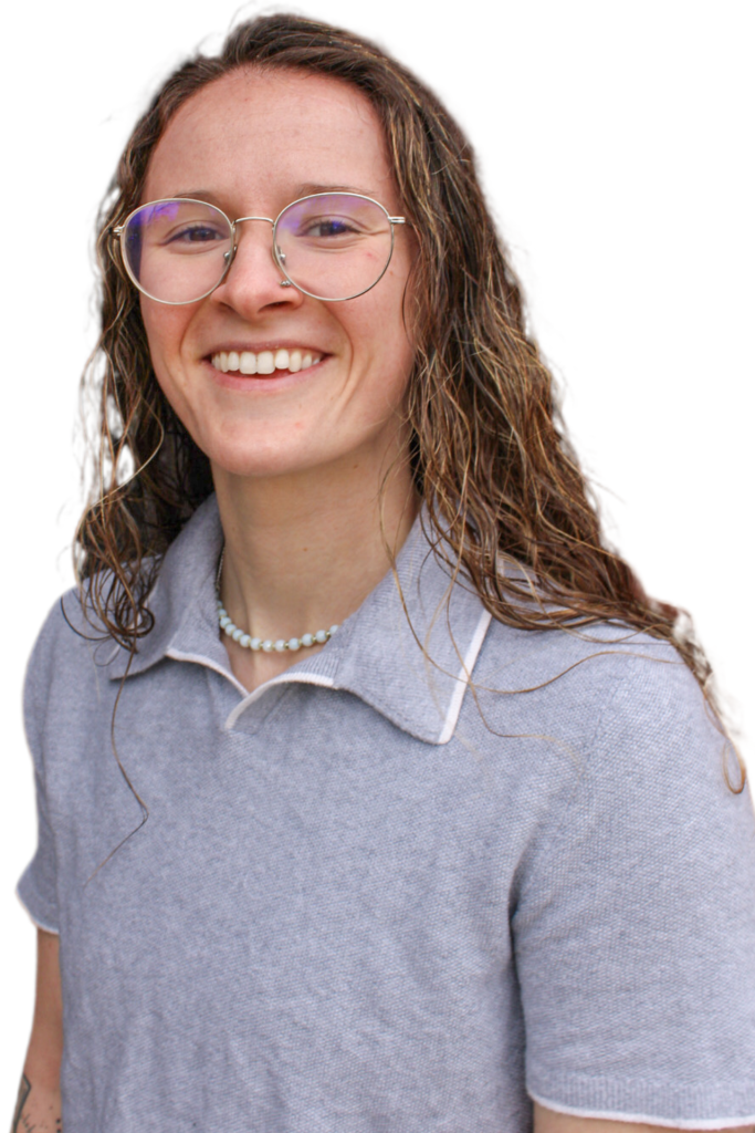 McKenna Green, LSW, smiling in a gray polo shirt, promoting mental health therapy at Serengeti Wellness, focused on anxiety support and holistic approaches.
